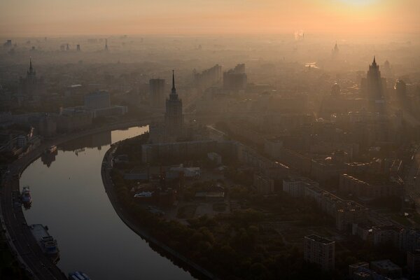 Misty dawn over the city river