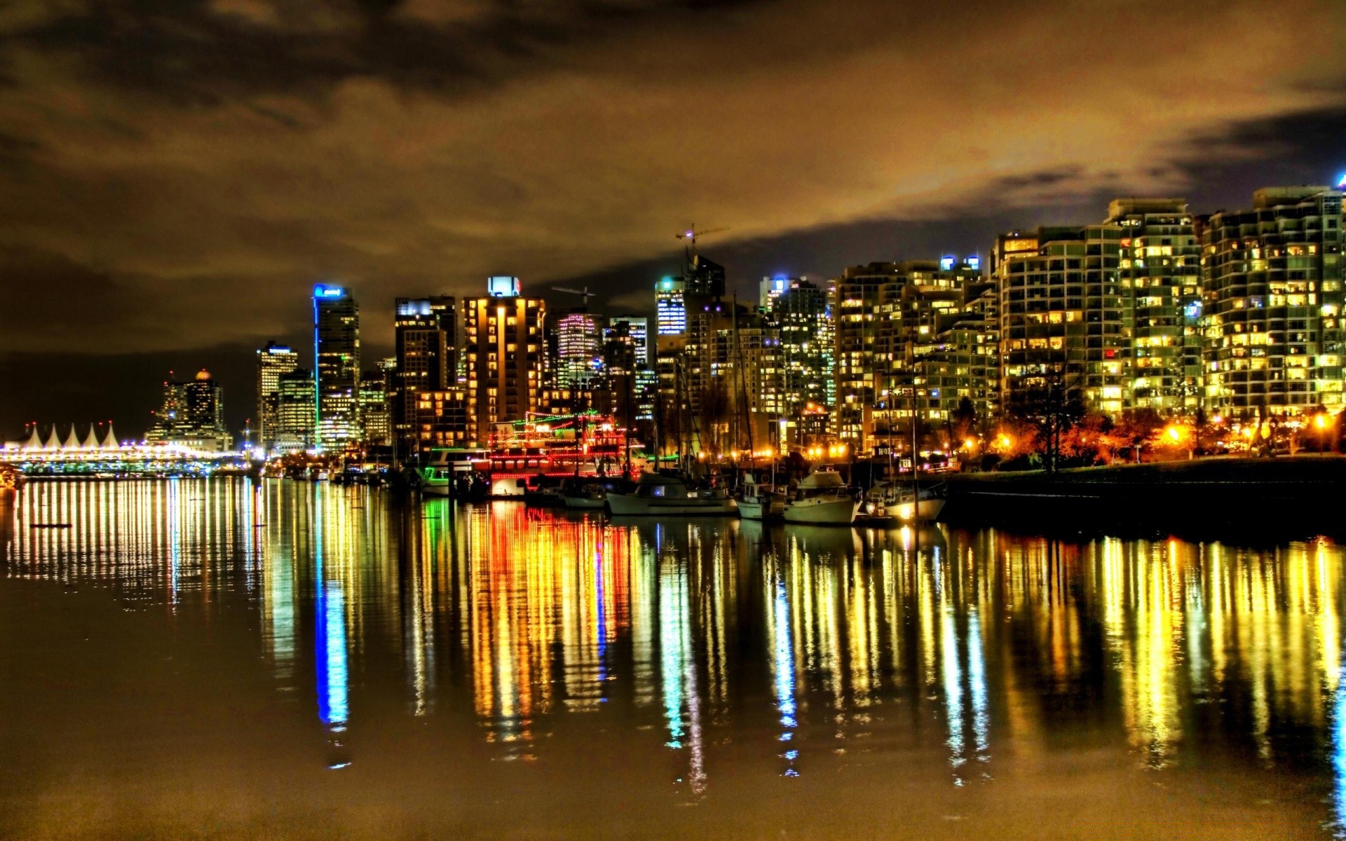 other city city cityscape downtown architecture skyline skyscraper water urban reflection building waterfront harbor dusk travel evening sunset river bridge sky pier