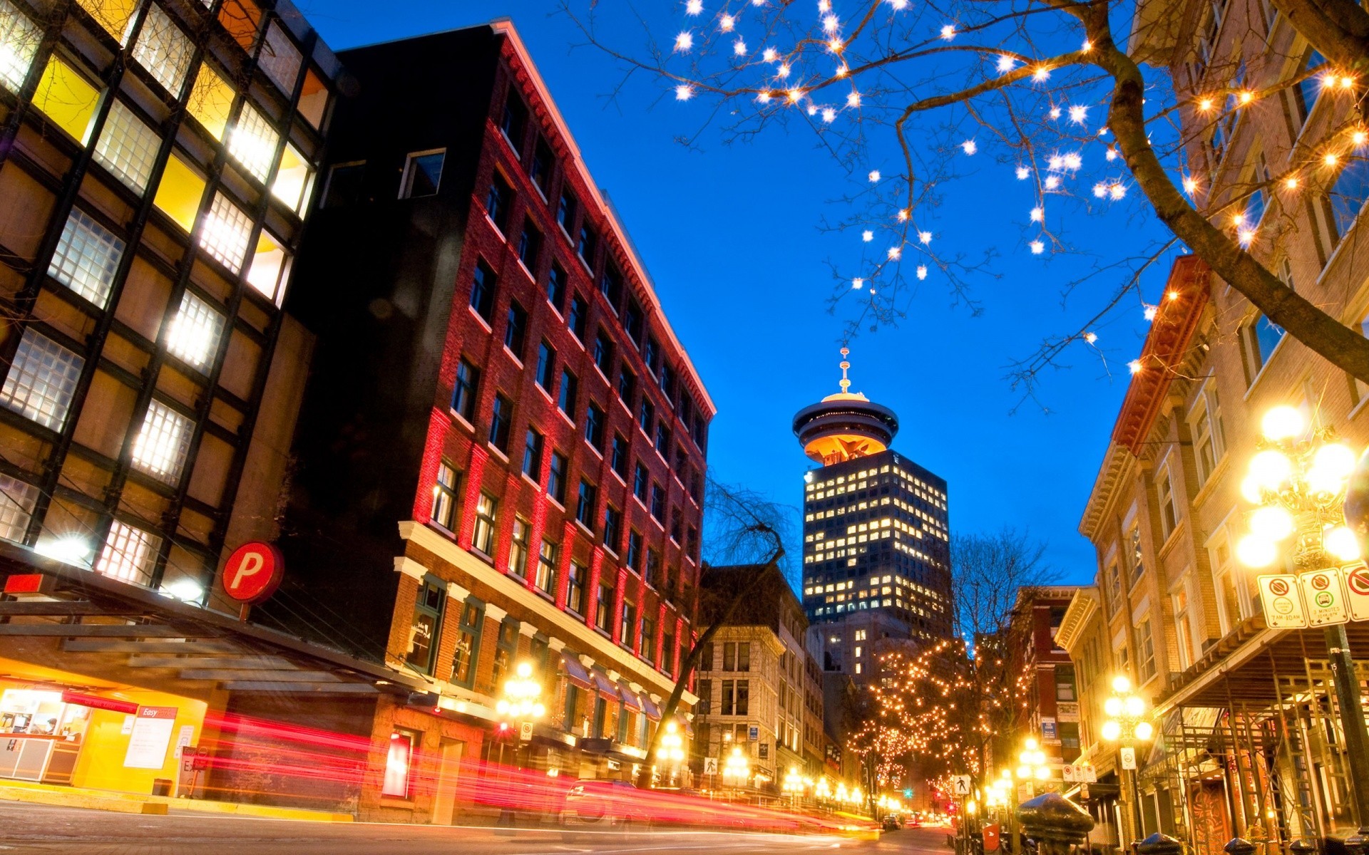 other city city street building illuminated travel evening urban architecture downtown light dusk traffic road modern cityscape nightlife business skyscraper