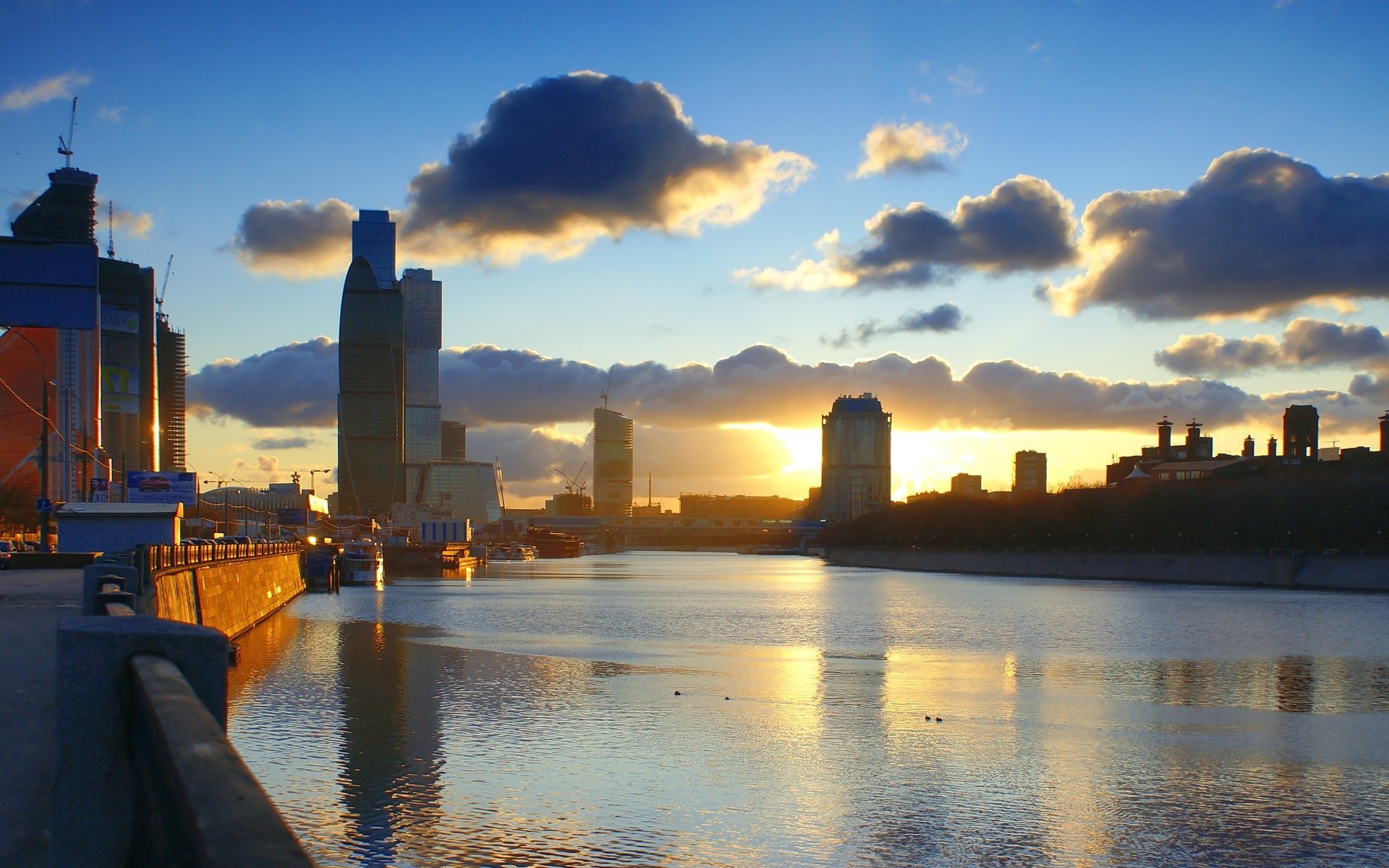 other city sunset water dusk architecture city evening sky dawn river travel skyline reflection cityscape outdoors building downtown skyscraper bridge