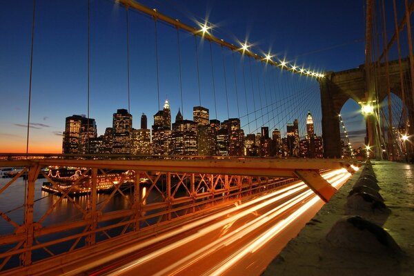 Photo with a long exposure of cars driving on the bridge