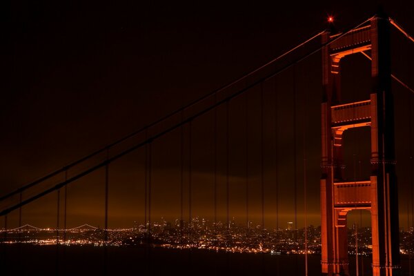 Suspension bridge support close-up at night