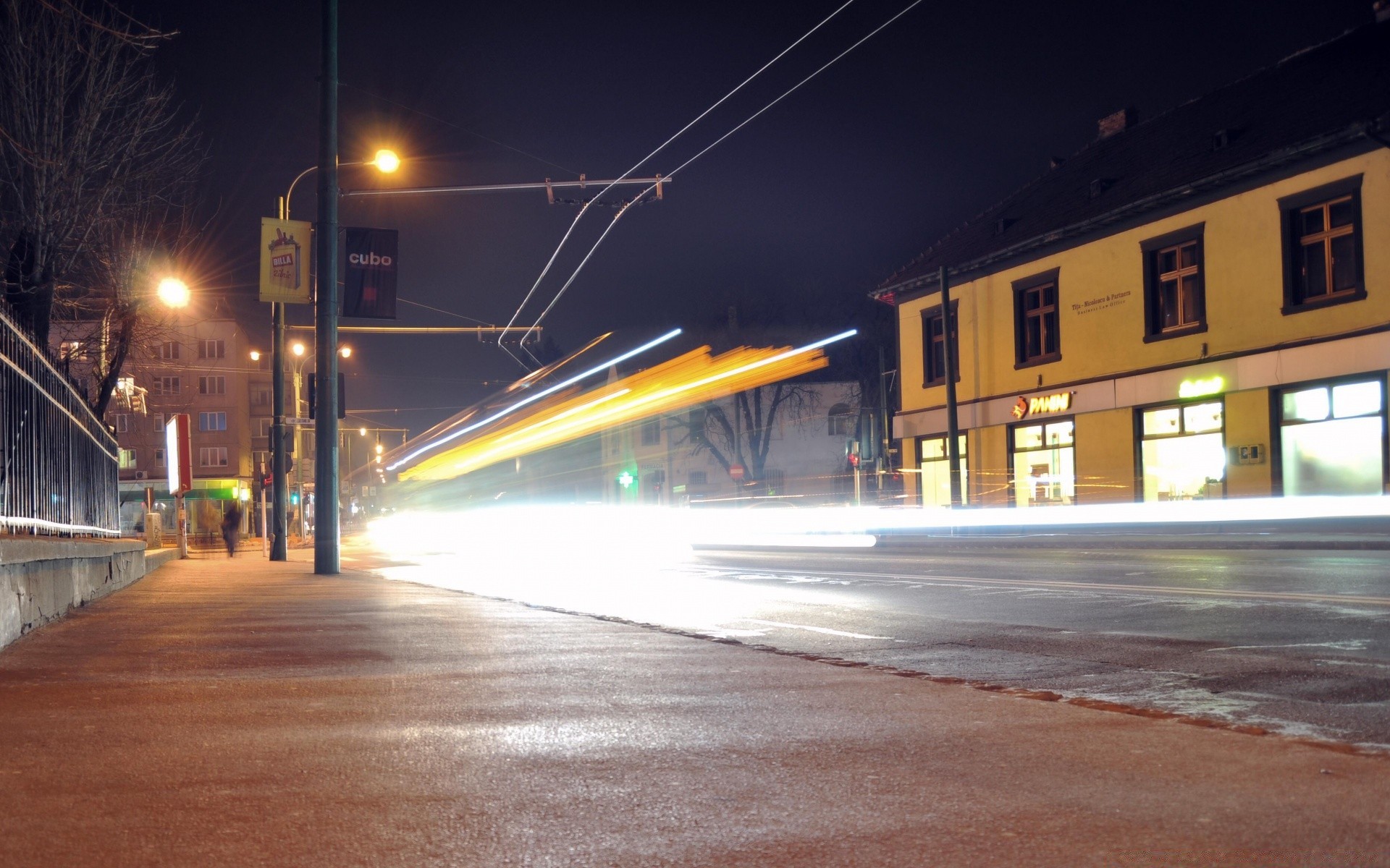 other city road street travel transportation system car city blur traffic light urban building architecture dusk evening bus motion bridge downtown