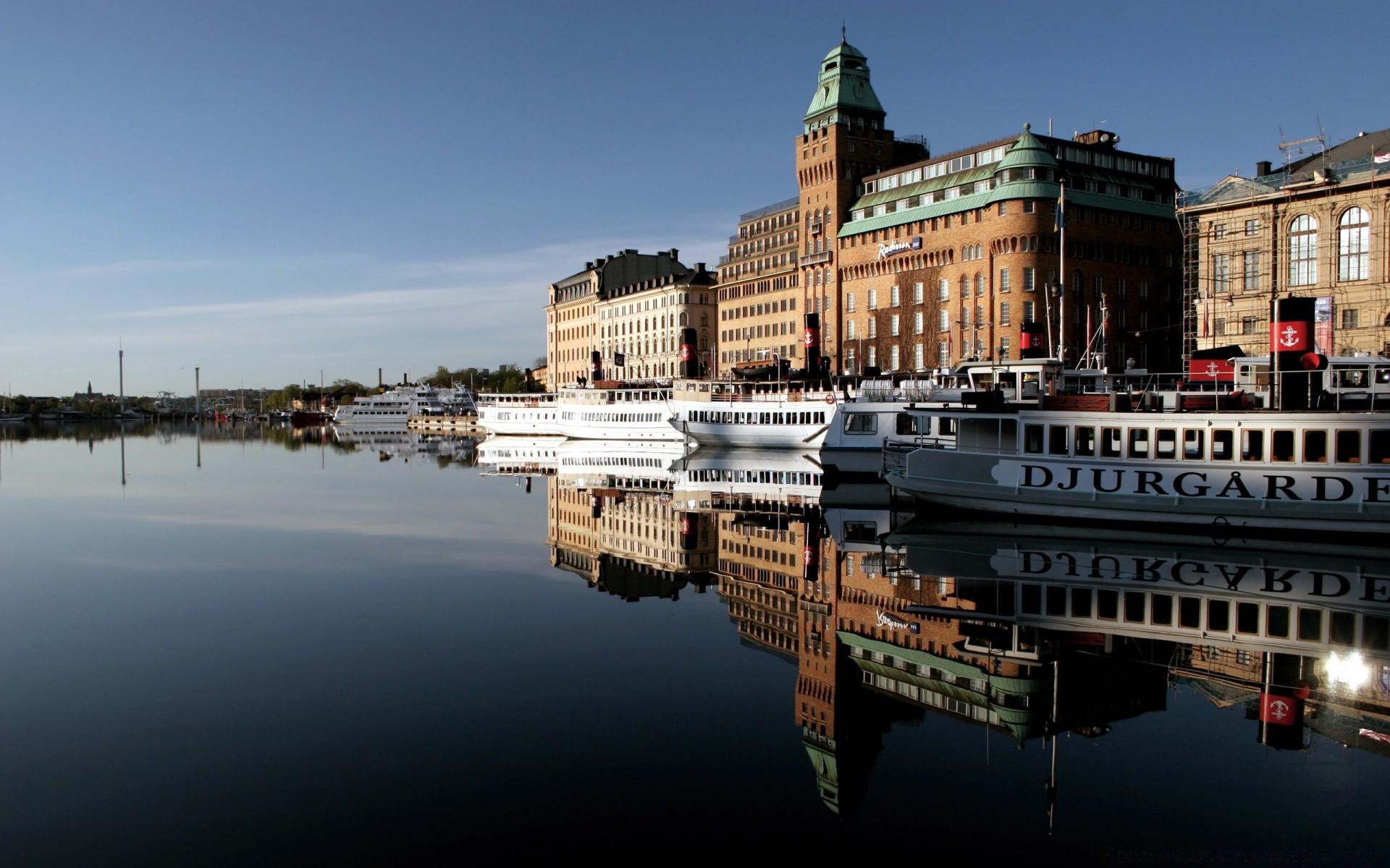 other city water travel architecture city river building reflection outdoors sky tourism watercraft transportation system harbor horizontal