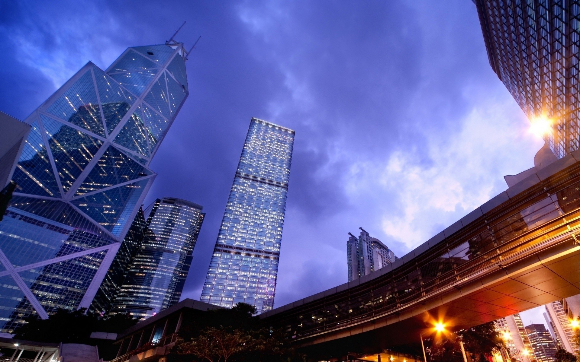 other city architecture city building sky evening light travel dusk skyscraper business urban bridge downtown cityscape road modern street construction tower