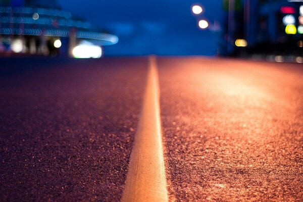 The line is blurred on an asphalt road