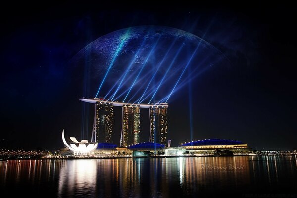 Installation by light at night by the water