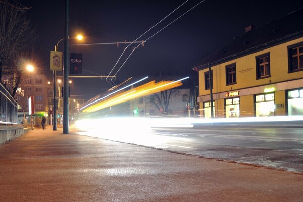 A brightly lit road at night