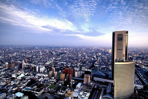 A modern city under the sky with clouds