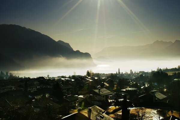 Morning fog over the water near the city