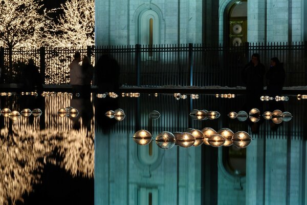 Reflection in the water temple and people