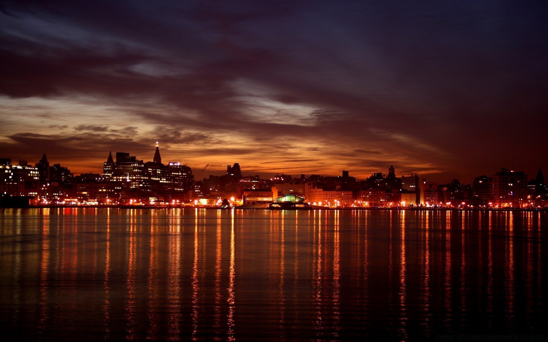 other city sunset water city dusk evening dawn sky reflection cityscape skyline travel river bridge architecture sea pier downtown harbor