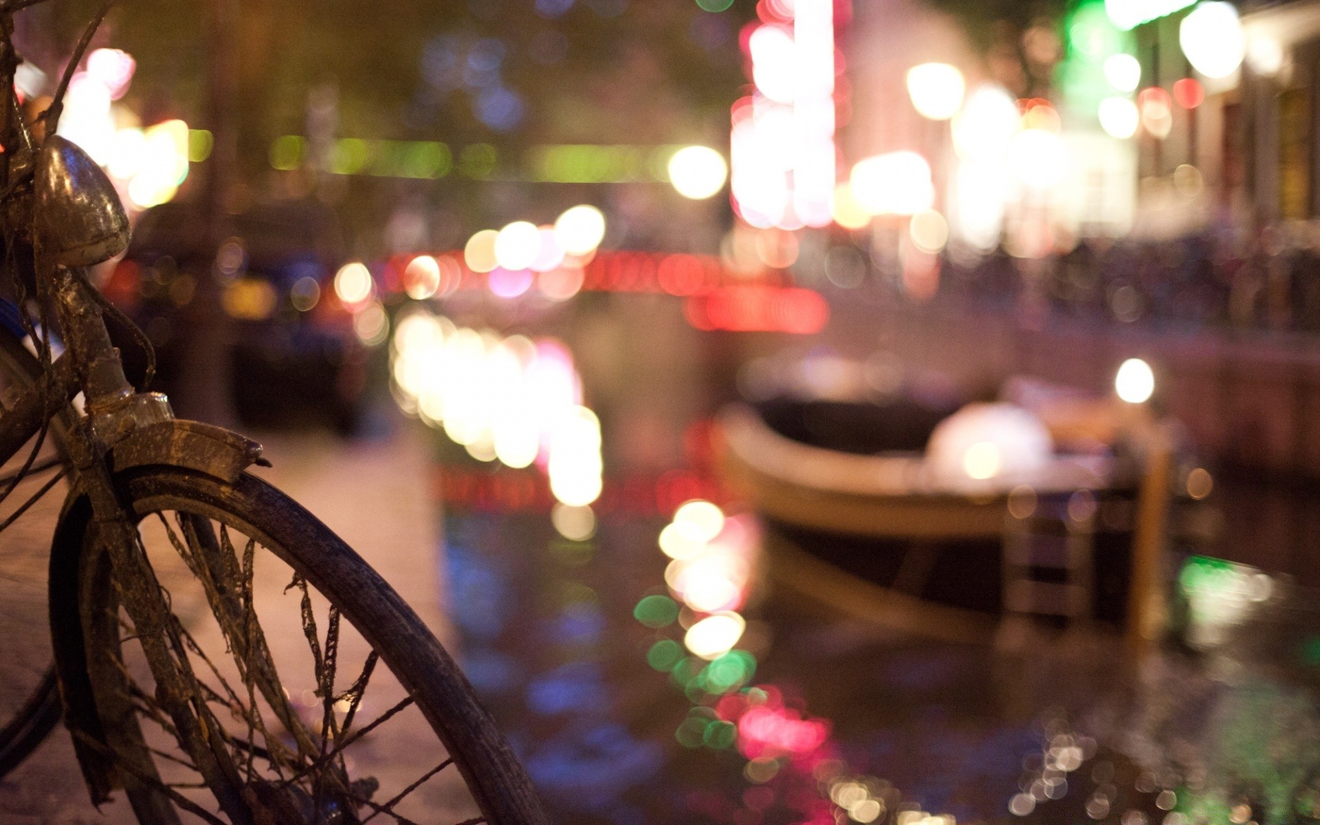 other city city street blur wheel travel light urban restaurant bike festival adult outdoors bar vehicle christmas