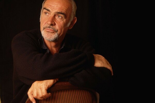 Portrait of an actor sitting on a chair