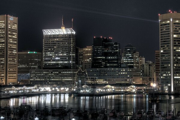 The city center in lights and reflection in the river