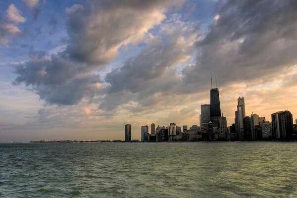 Sunset of the sky over the water in the city