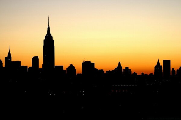 Urban landscape. Sunset. Dark Houses