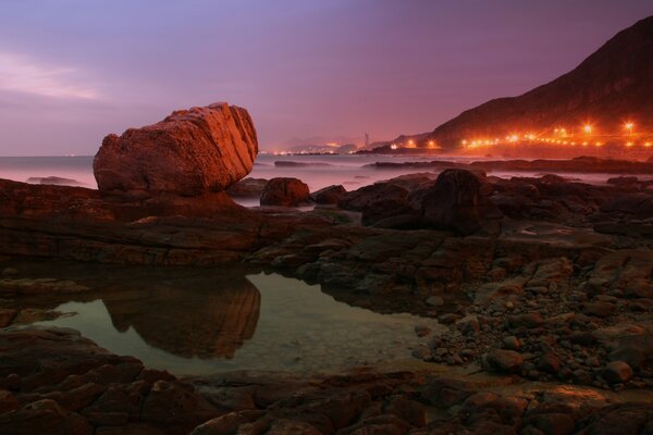 Sunset landscape reflection stone water