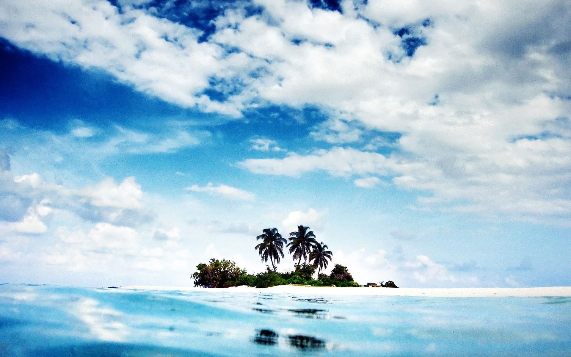 ilhas praia água oceano verão céu viagens tropical mar natureza mar paisagem ilha sol areia ao ar livre paisagem bom tempo nuvem cênica