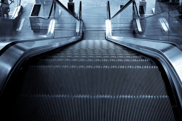 Escalator in the subway in gloomy colors