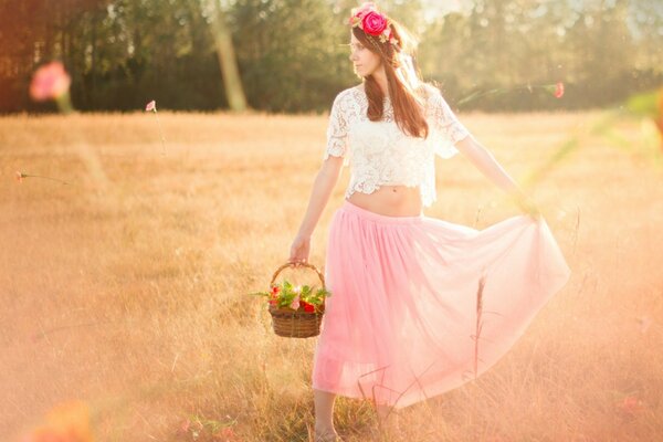 A girl in airy clothes with a basket