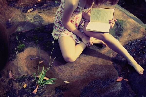 A girl with a book is romantic and beautiful