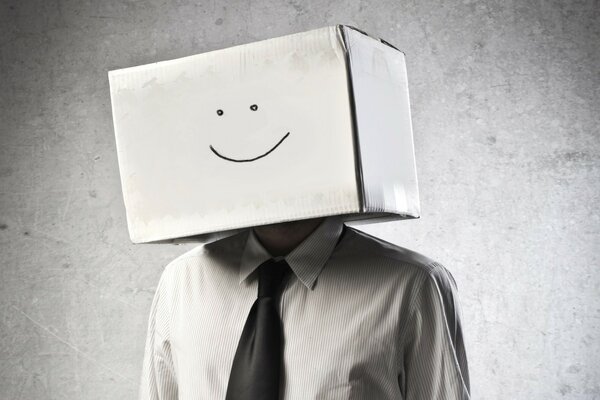 A business man with a box on his head is cute