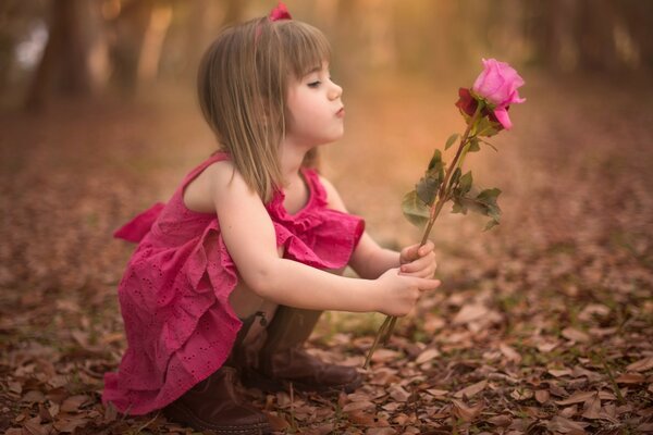 A little girl with flowers in her hands