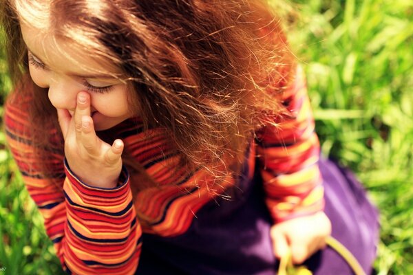 A child smiles in nature, romance