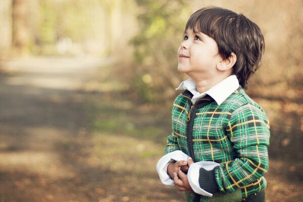 The child is enjoying the autumn day