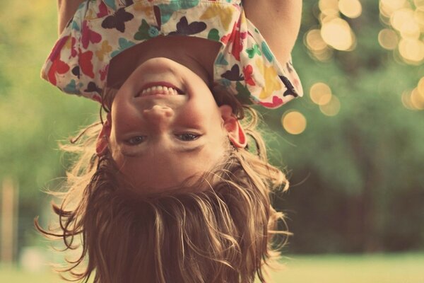 A little girl on the background of a summer day