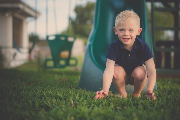 A child in the garden on the green grass