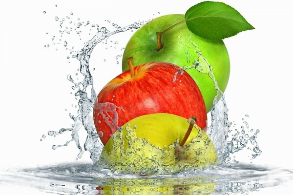 Colorful apples splash in the water