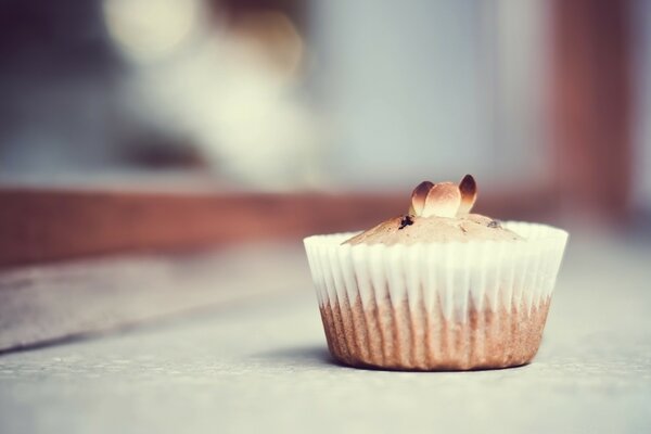 A small delicious dessert in the form of a cupcake