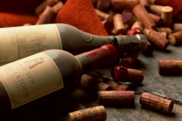 Bottles of aged wine and corks