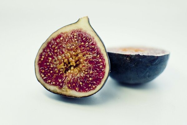 Cut fruit of blue figs color photo