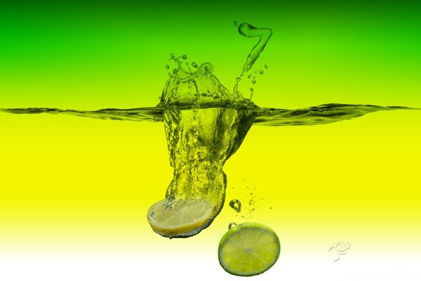 Lemon and lime fall into the water