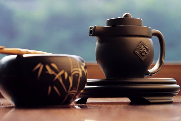 Dark clay teapot with hieroglyph