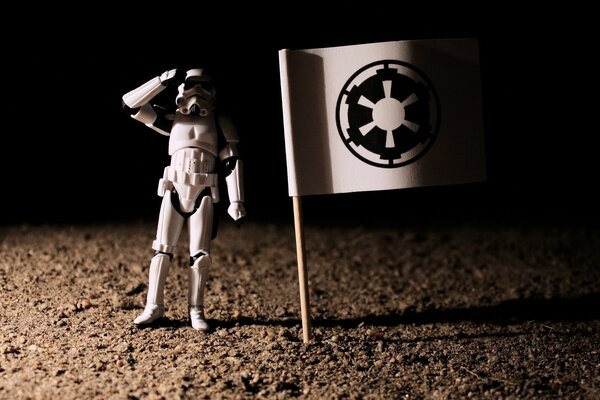 A Star Wars action figure with a flag