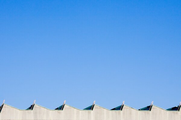 Blue summer sky over the roof