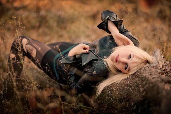 Blonde lying in the field