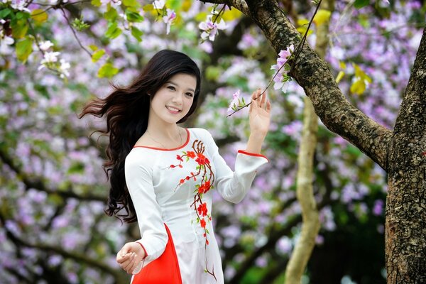 A flower girl in a blooming garden