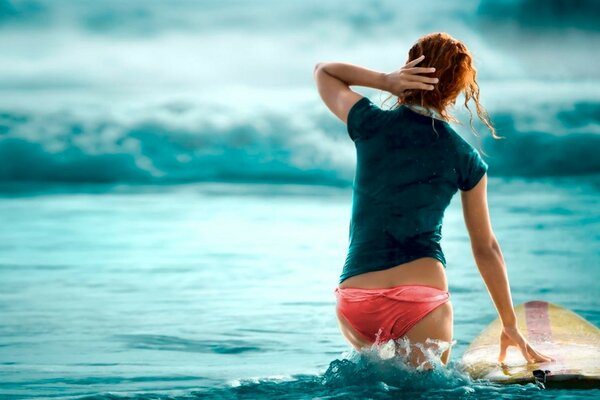 A surfer with a yellow board went out for training