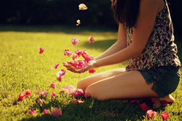 Colorful flowers in the hands of a girl