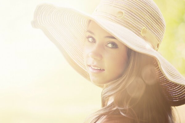 Portrait of a young girl in a hat