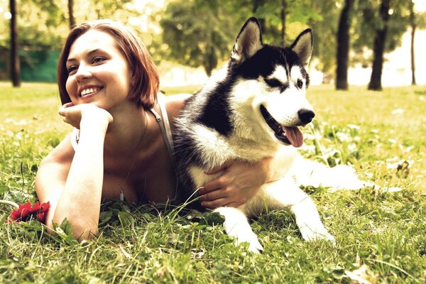 Girl dog grass bright light smile