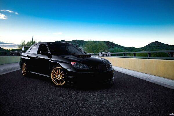 Cool black car on black asphalt