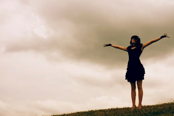 A girl in a dress. Evening sky