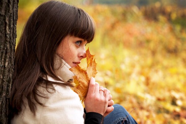 Girl autumn in nature alone