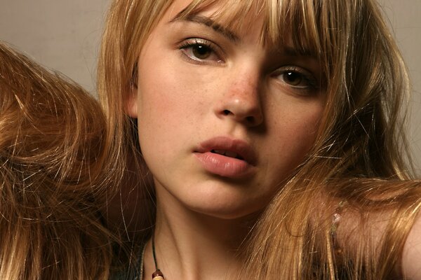 Portrait of a beautiful girl with freckles